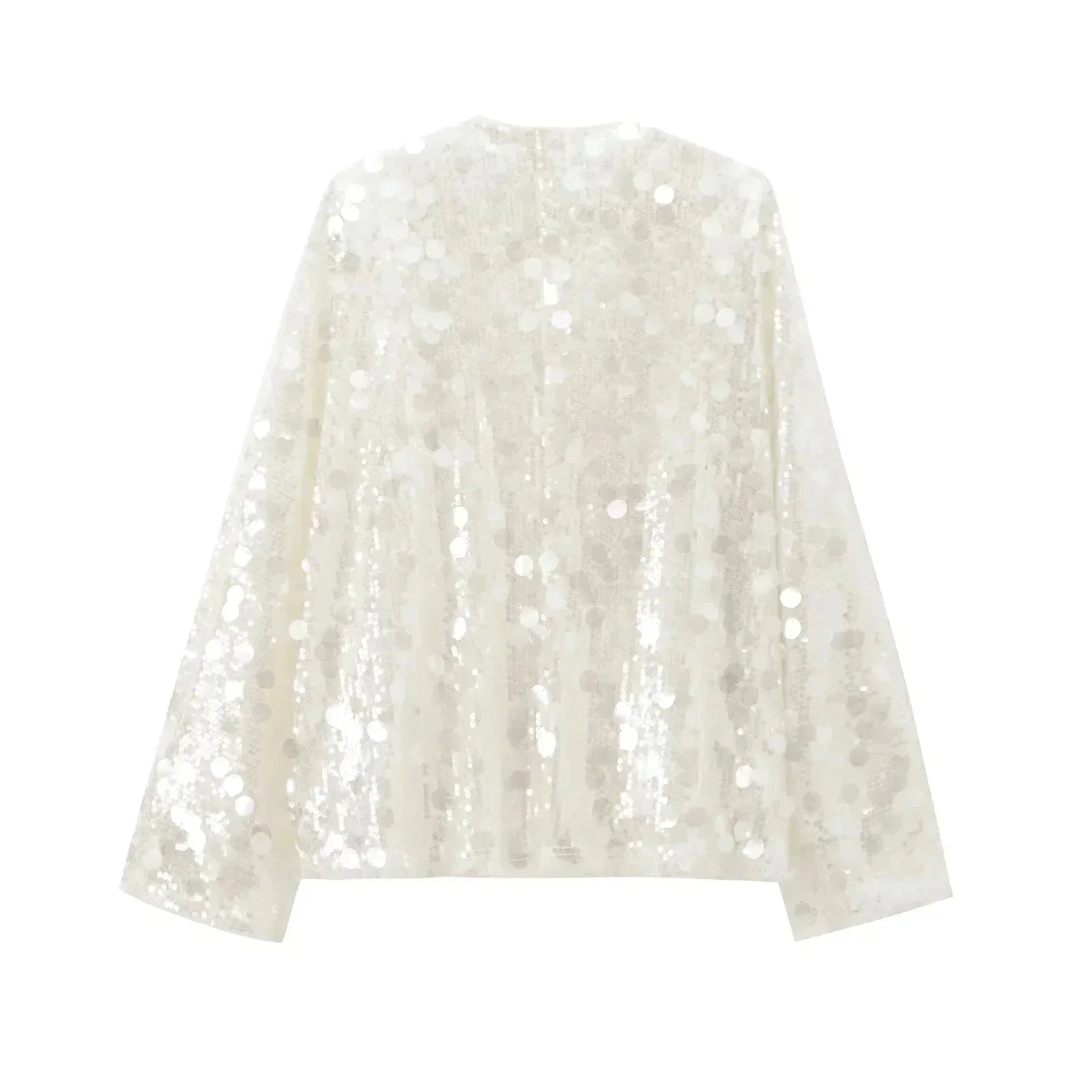 Blouse ivoire à paillettes avec col en V, en tissu léger, parfaite pour une tenue élégante et festive.