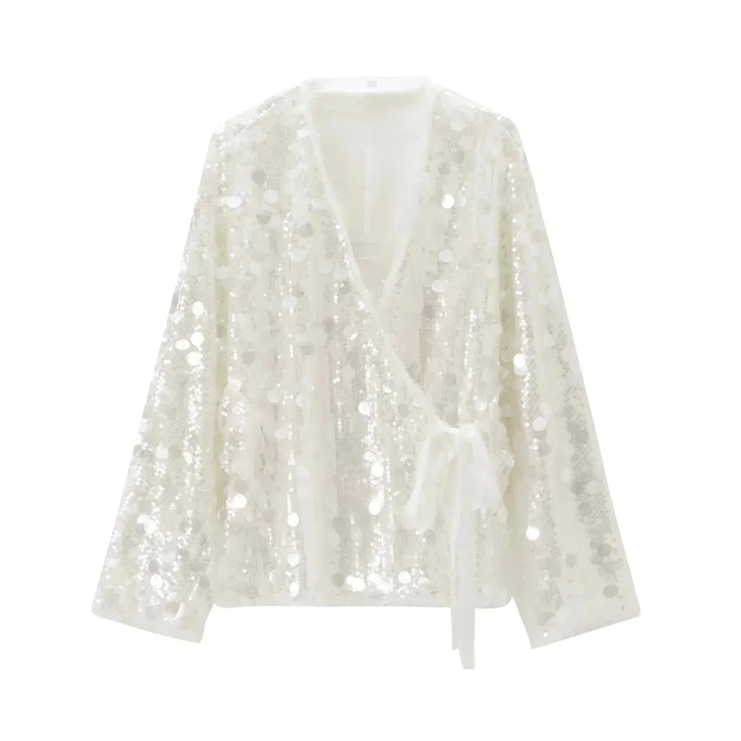 Blouse femme ivoire en tissu léger, paillettes scintillantes et col en V pour une touche d'élégance subtile.