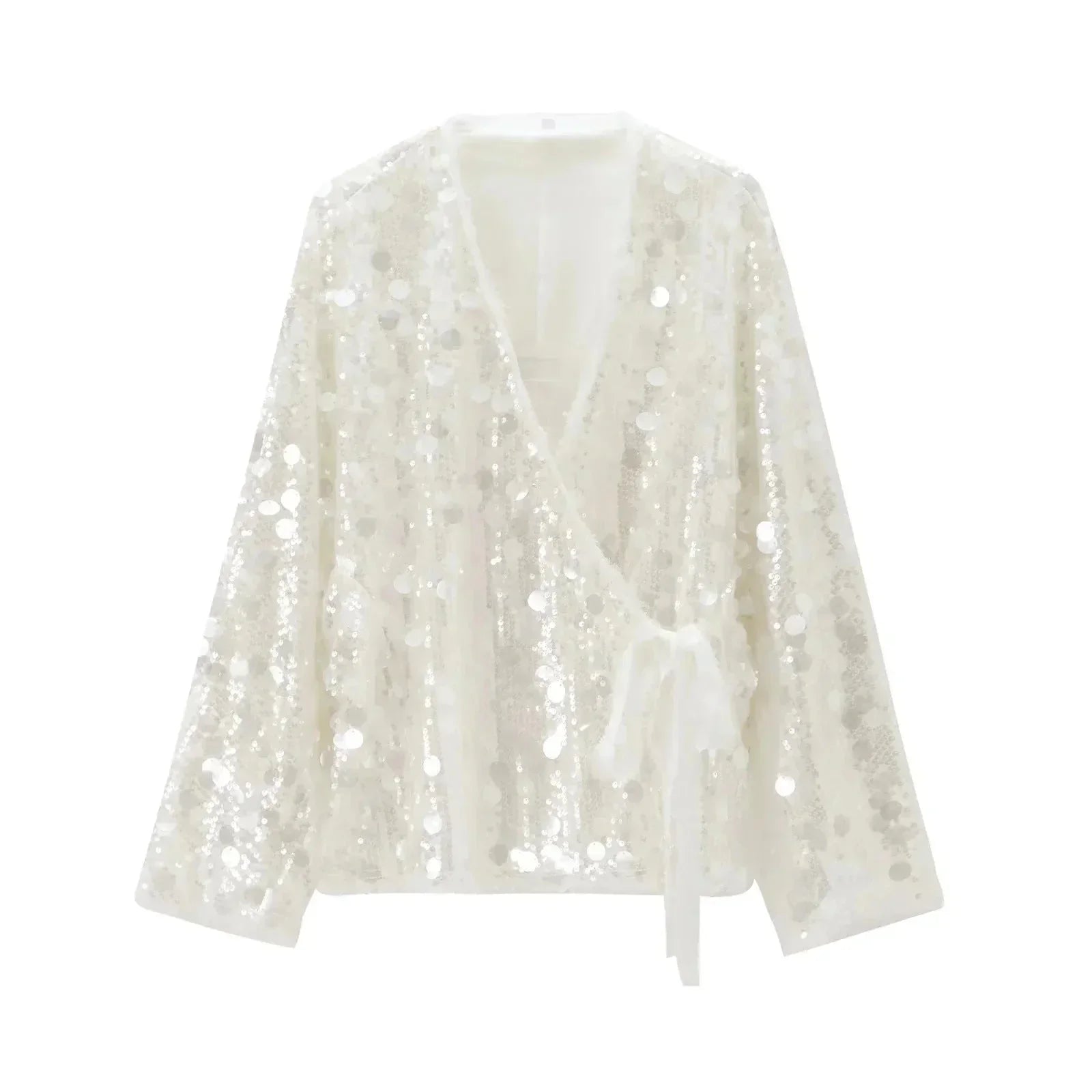 Blouse femme ivoire en tissu léger, paillettes scintillantes et col en V pour une touche d'élégance subtile.