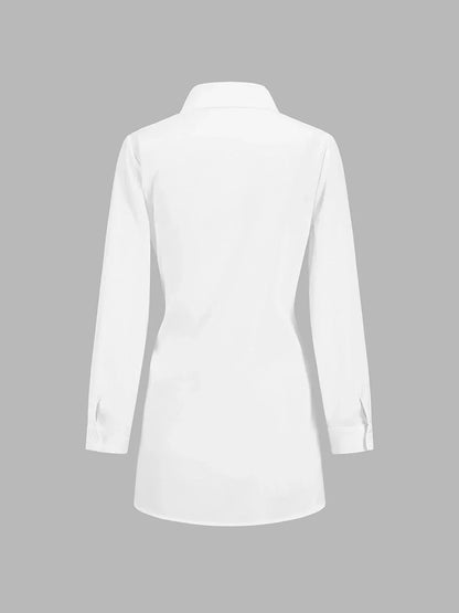 Blouse femme en coton léger, nouée devant, avec manches boutonnées pour un style décontracté et élégant.