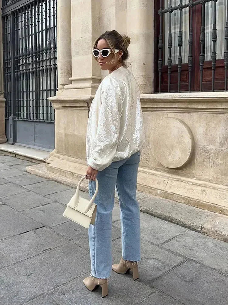 Bomber femme ivoire avec sequins, design scintillant et fermeture éclair à l'avant.