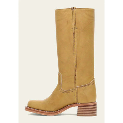 Bottes femme marron foncé style cowboy, hauteur genou, talon large et design orné.