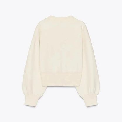 Cardigan crème à manches longues, boutons stylés, en matière douce, coupe classique pour femme.