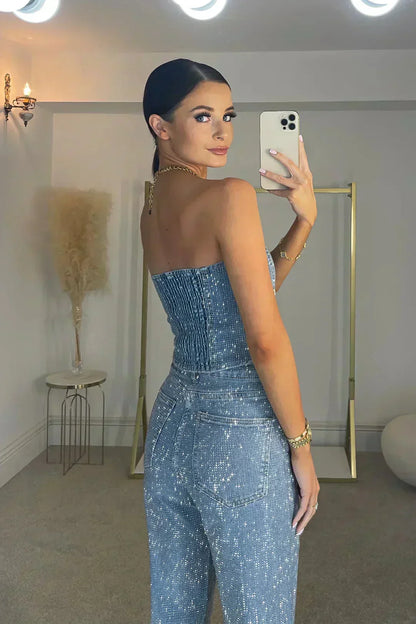 Combinaison soirée femme noire, bustier avec jambes larges, en tissu léger et respirant.