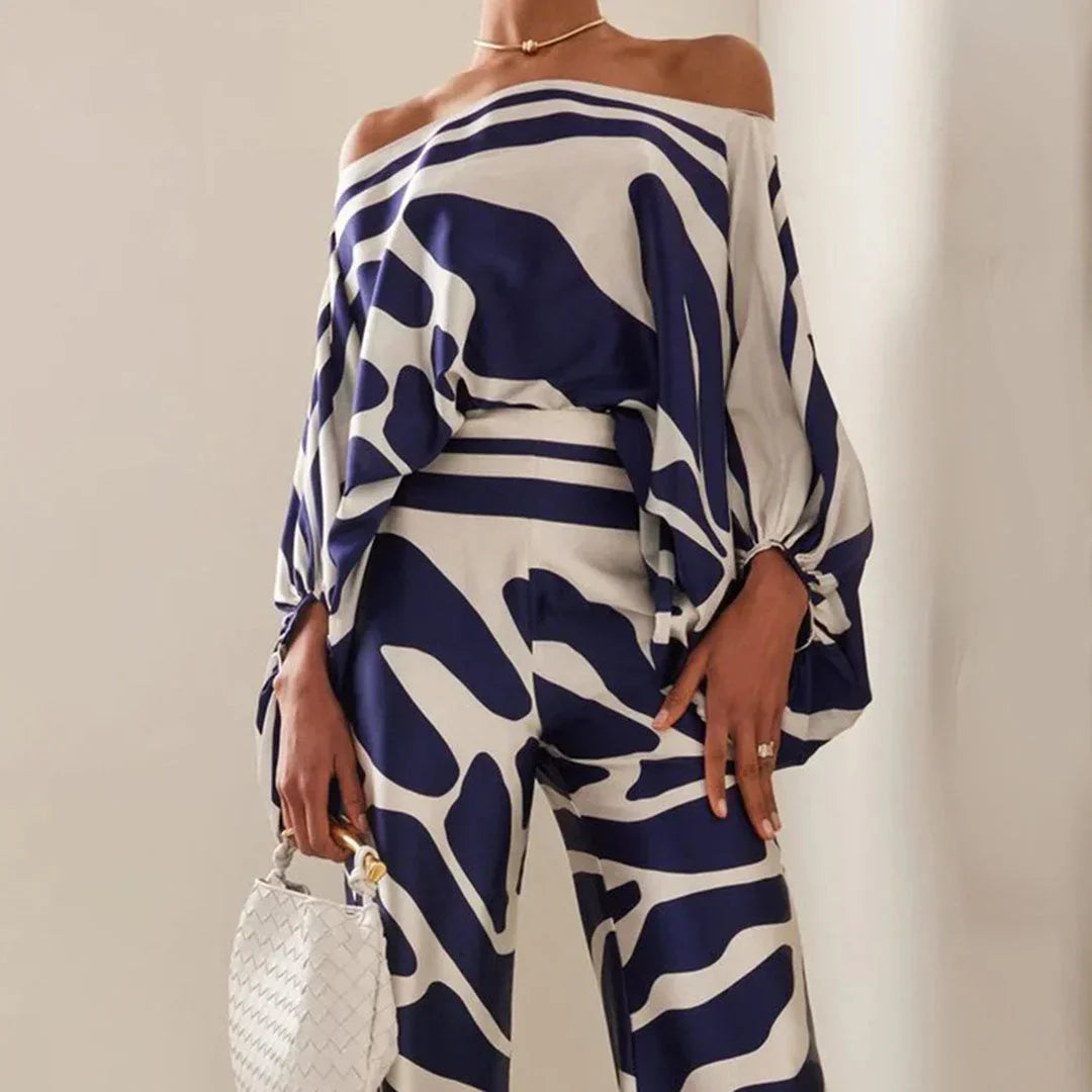 Ensemble femme en jersey, avec manches tombantes et pantalon droit, idéal pour un look décontracté et confortable.