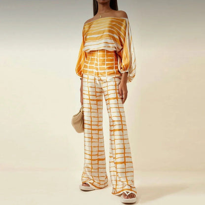 Ensemble femme en tissu léger, jaune, avec manches tombantes et pantalon droit, parfait pour une tenue décontractée.