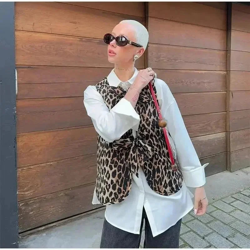 Leopard-print women’s vest with elegant knots, made from soft fabric, perfect for layering in casual outfits.