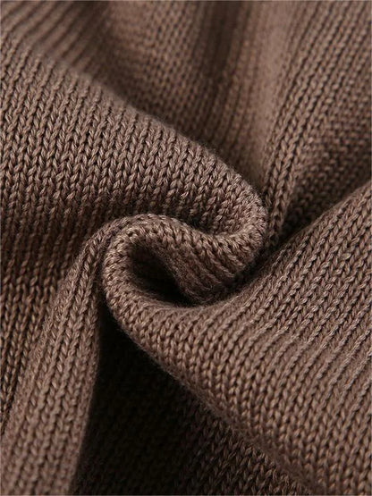 Haut femme en tricot avec dos ouvert et manches évasées.