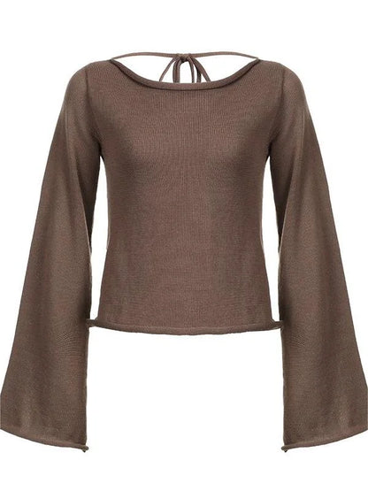Haut femme noir en tricot, dos ouvert, manches évasées.