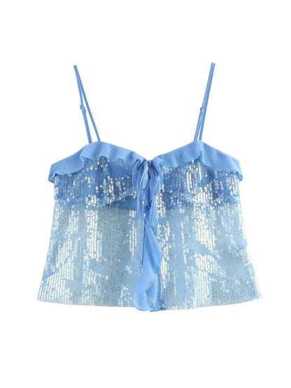 Haut femme bleu à sequins, avec détails en volants transparents pour un look élégant et festif.