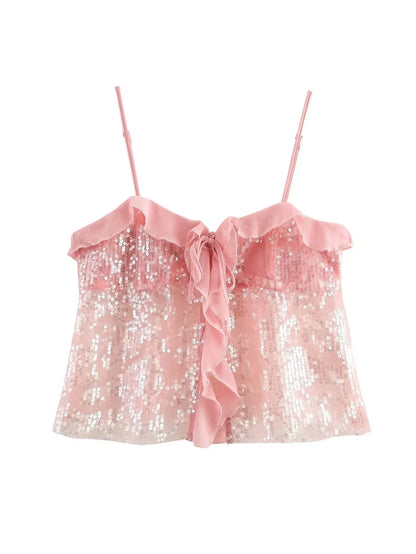 Haut femme en rose, en sequins brillants, avec volants transparents délicats pour une touche féminine et élégante.