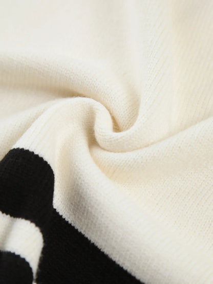 Pull à col montant rayé pour femme en mélange de coton, coupe décontractée et col haut.