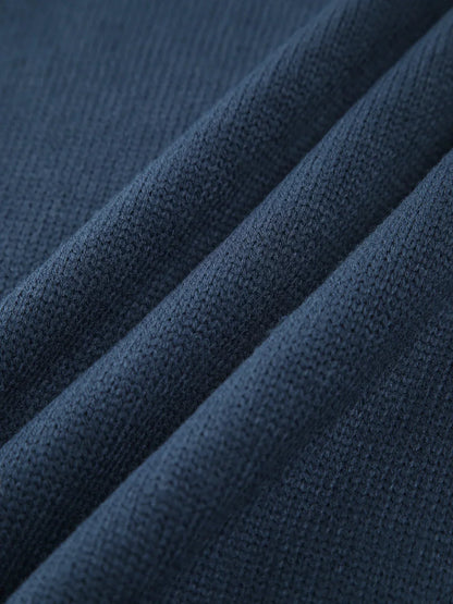 Pull col roulé côtelé pour femme, manches longues, en mélange de coton extensible pour un confort optimal.