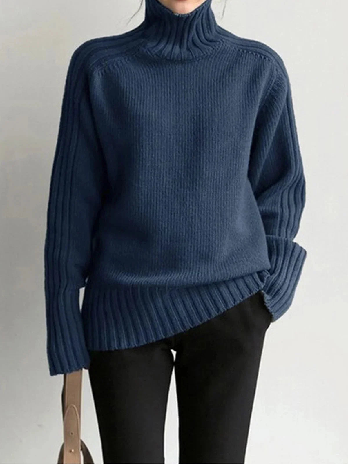 Pull col roulé noir pour femme, manches longues, en tissu côtelé.