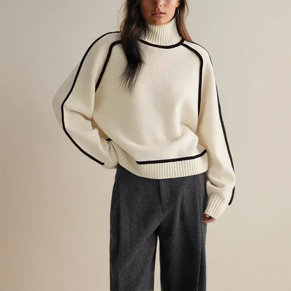 Pull col roulé femme en brun, avec bordure contrastée et coupe ajustée.