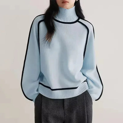 Pull col roulé femme beige en matière douce, avec bordure contrastée pour un style moderne.