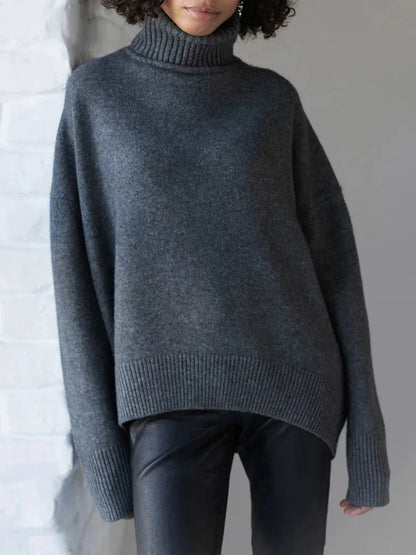 Pull col roulé blanc pour femme, en mélange de coton, manches longues et bords côtelés.