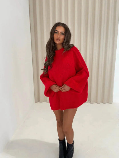 Pull femme ample en coton avec col roulé, disponible en plusieurs couleurs douces.