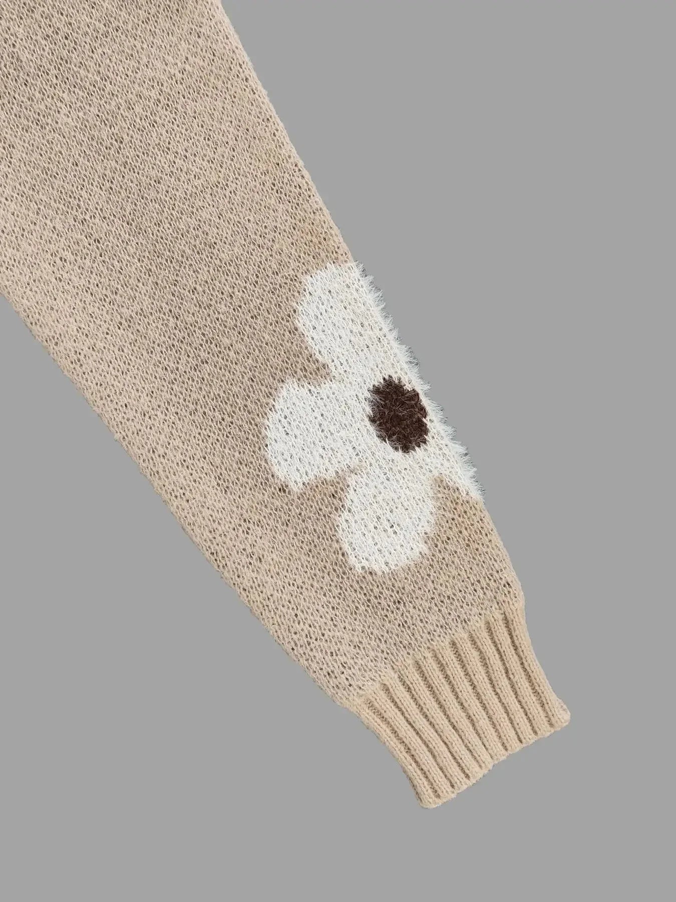 Pull femme en coton, col rond, motif floral aux couleurs douces, style décontracté.