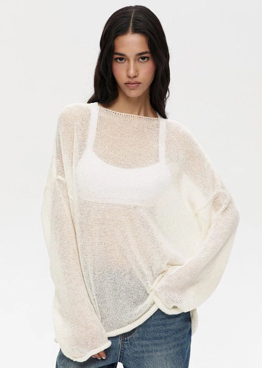 Pull femme léger en maille transparente, coupe décontractée, tissu respirant et design élégant.