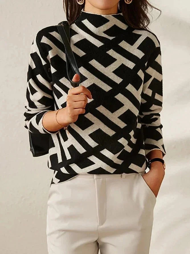 Pull femme noir et blanc à motif géométrique, coupe décontractée en mélange de coton.