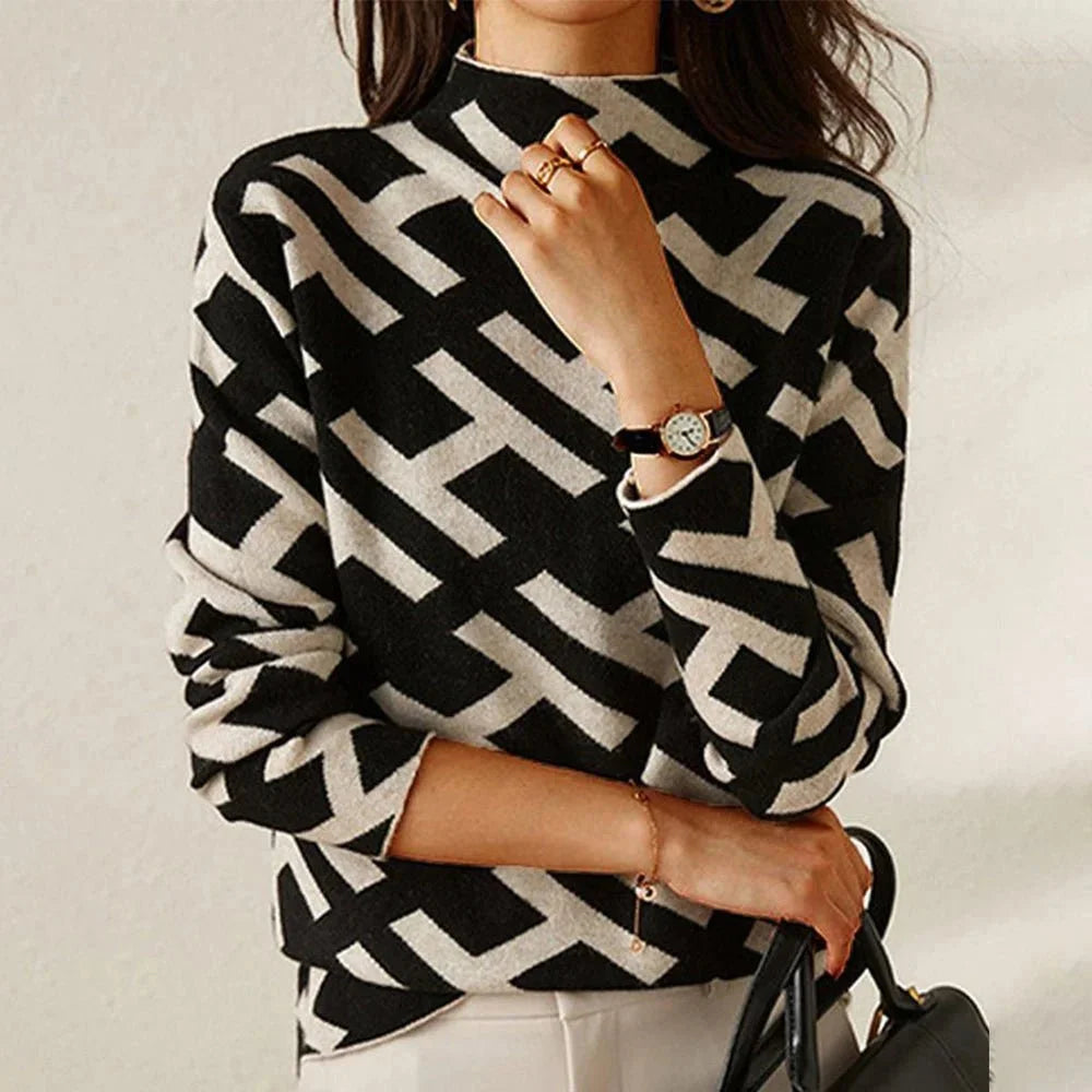 Pull femme noir et blanc à motif géométrique, en mélange de coton, coupe décontractée.