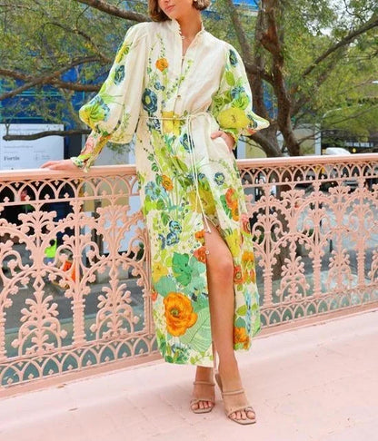 Robe chemise midi fluide avec manches bouffantes et imprimé floral, parfaite pour les soirées printanières et estivales.