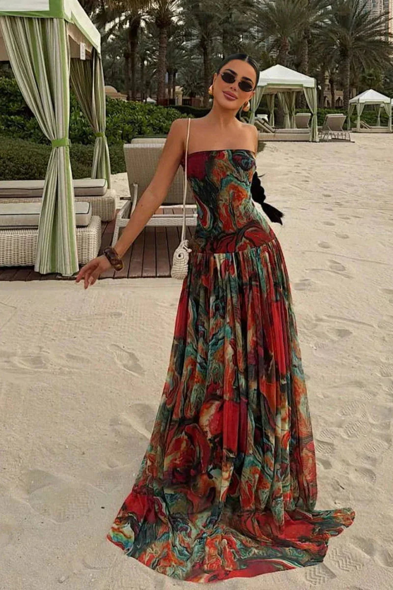 Robe d'été femme multicolore avec bustier, en coton léger, motifs floraux et jupe fluide pour une allure estivale.
