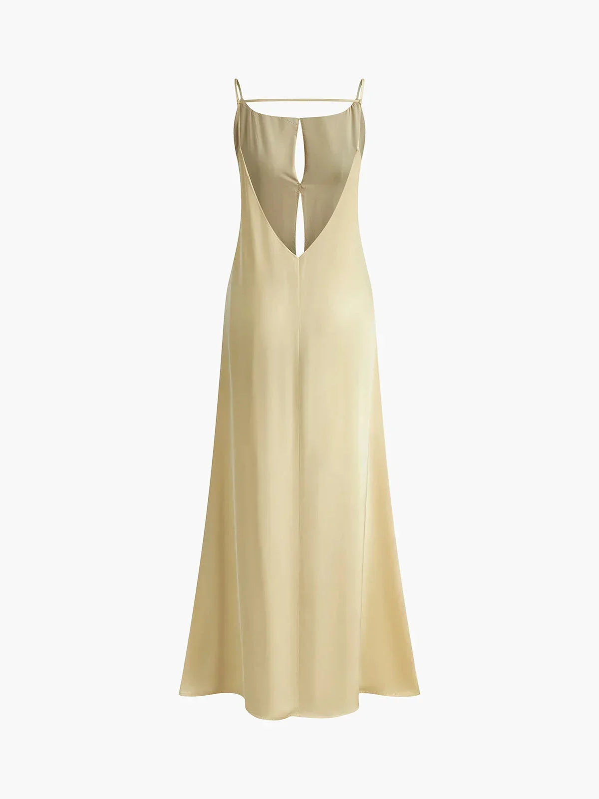 Robe longue jaune à dos nu avec fines bretelles, conçue en tissu léger et fluide, idéale pour les journées d'été.