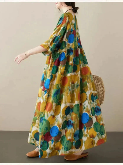 Robe longue ample pour femme, en tissu léger avec imprimé artistique et manches mi-longues, parfaite pour un look…