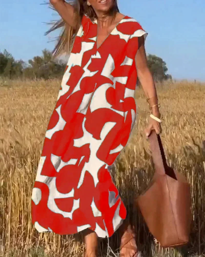Robe longue femme en tissu léger, col V, motifs fluides pour un look élégant et confortable. Parfaite pour l'été.