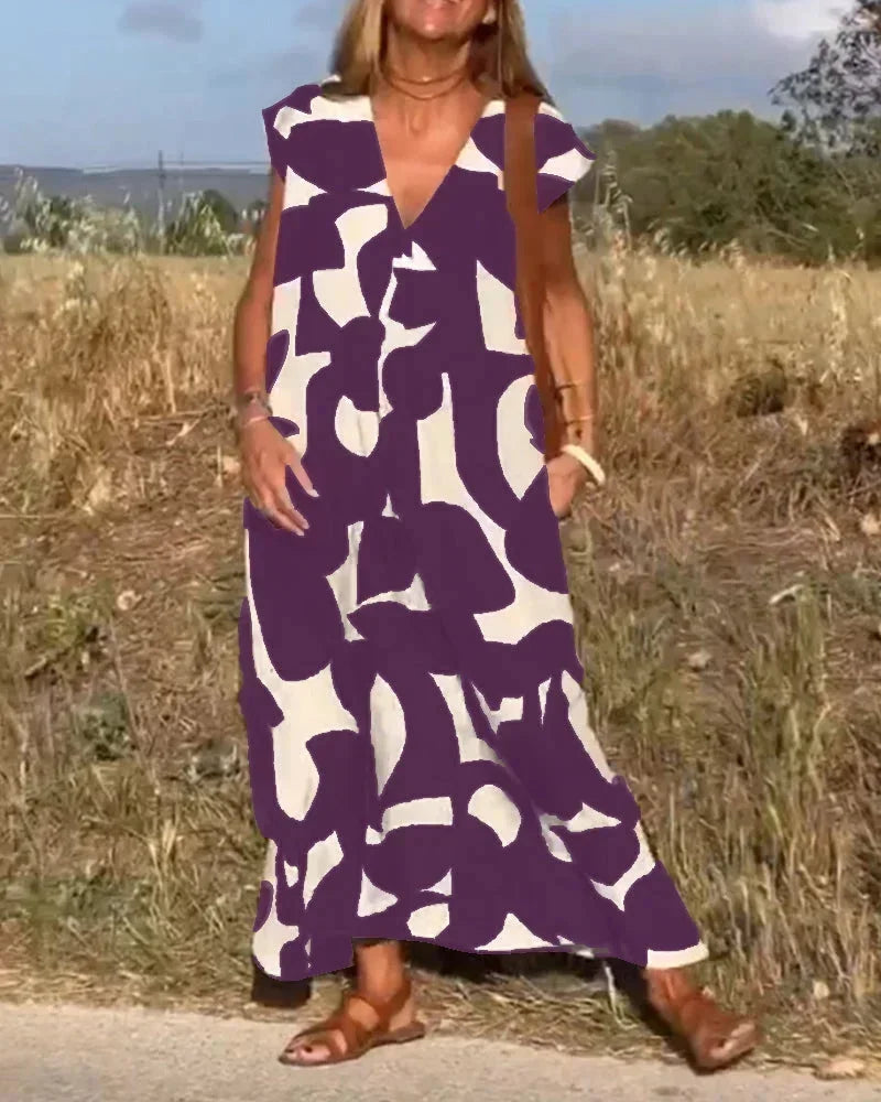 Robe longue femme en tissu léger, col V, motifs fluides et coupe décontractée parfaite pour un look d'été.