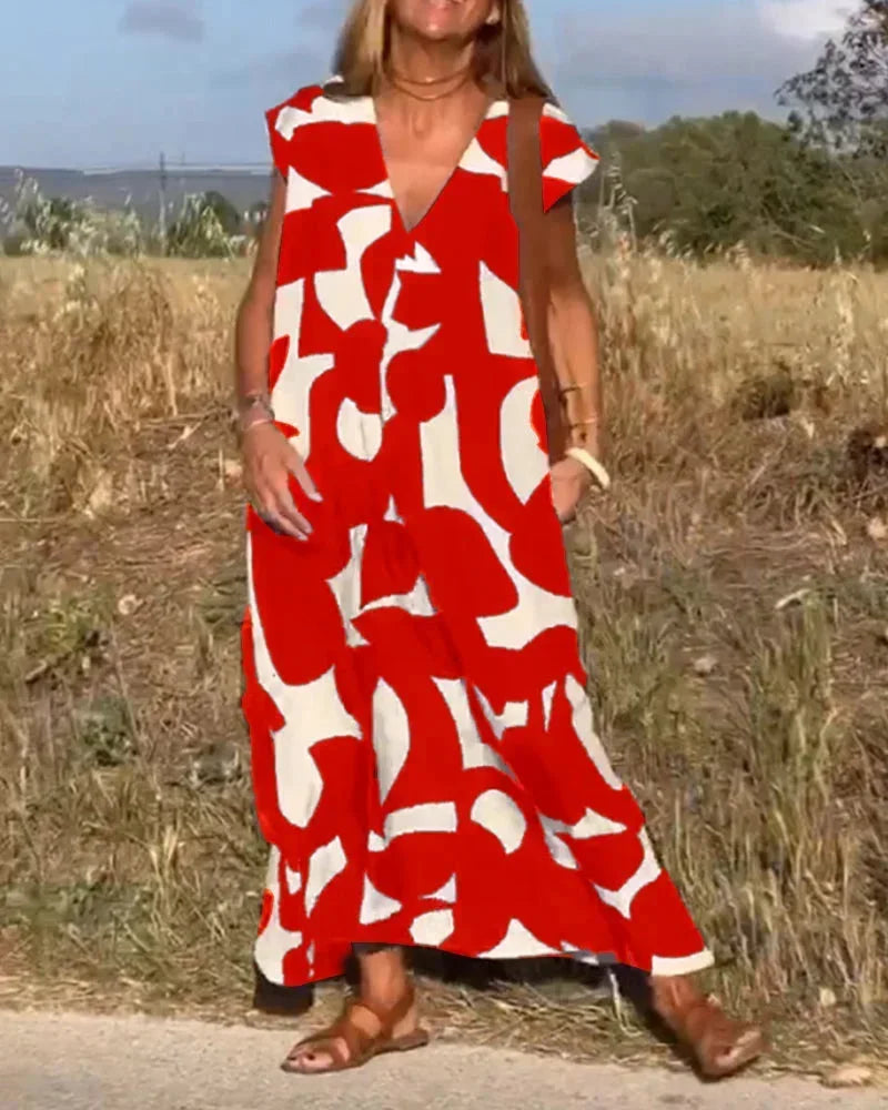 Robe longue rouge femme avec col V, en tissu léger, motifs fluides et coupe élégante pour un look décontracté.