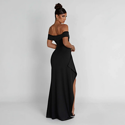 Robe longue femme en tissu léger, épaules dénudées, élégante fente sur le côté pour un look moderne et aéré.