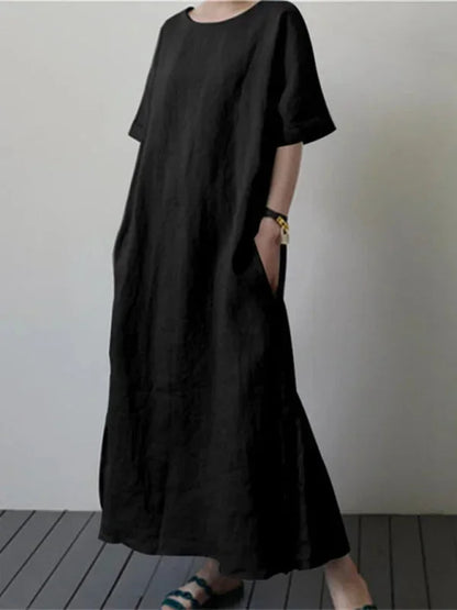 Robe longue femme en coton, col rond, avec ceinture ajustable pour un ajustement personnalisé et un look élégant.