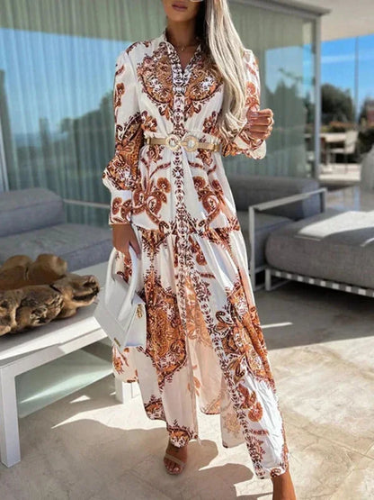 Robe longue femme orange, imprimée avec une fente haute et col V, en tissu léger et fluide, parfaite pour l'été.