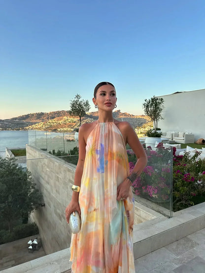 Robe longue femme imprimée, tissu léger, dos nu élégant, idéale pour les journées d'été et les occasions festives.
