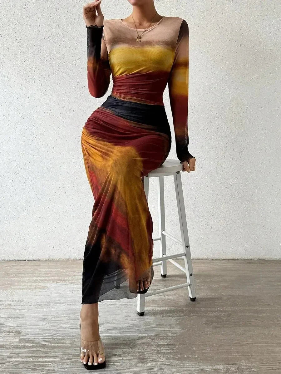 Robe longue femme en tissu léger, à manches longues, avec un motif unique et coupe élégante pour un look décontracté.