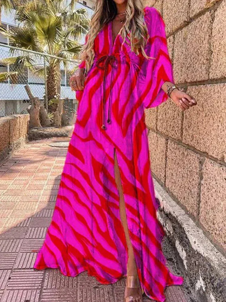 Robe longue femme à motifs en rouge rose, manches longues, ceinture pour ajustement, tissu léger et fluide.