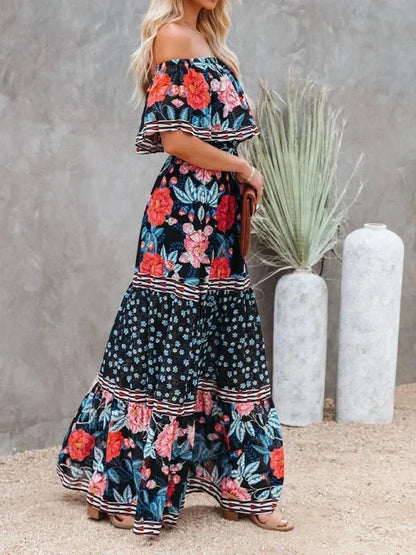 Robe longue femme à épaules dénudées en tissu léger avec motifs floraux colorés, idéale pour les journées d'été.