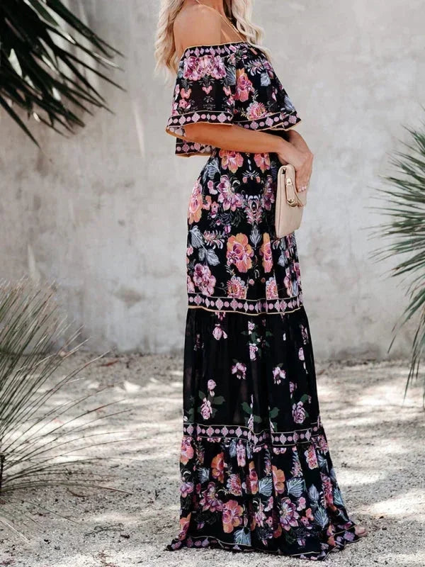 Robe longue femme à épaules dénudées, en coton léger, avec motifs floraux colorés et coupe évasée élégante.