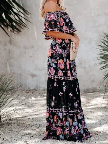Robe longue femme à épaules dénudées, en coton léger, avec motifs floraux colorés et coupe évasée élégante.