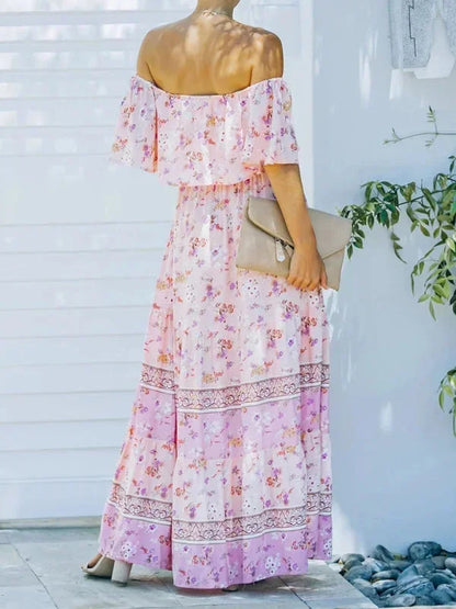 Robe longue femme, épaules dénudées, en tissu léger avec motifs floraux colorés, idéale pour les journées d'été.