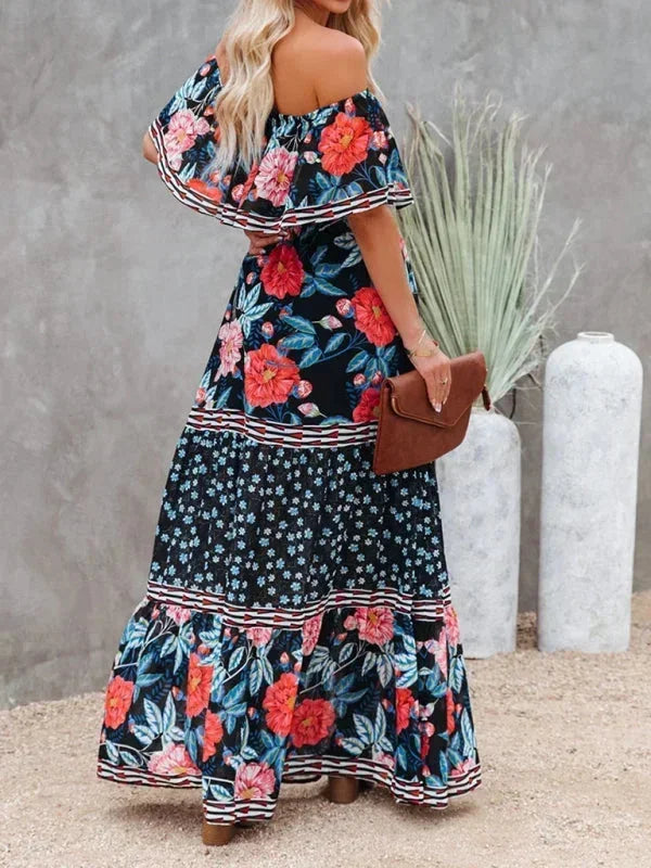 Robe longue femme à épaules dénudées, en coton léger, avec motifs floraux colorés et coupe fluide pour un confort estival.