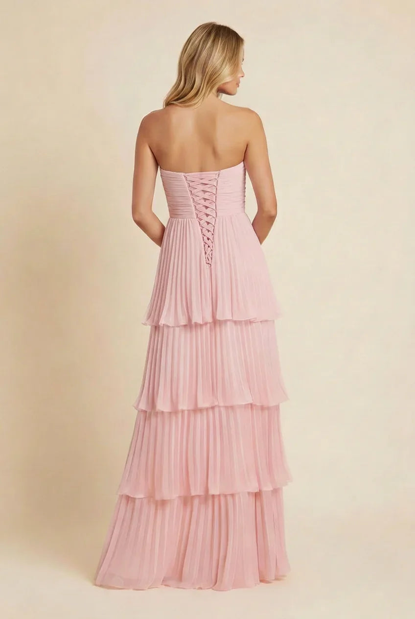 Robe longue femme rose sans bretelles, en tissu léger, avec design fluide et coupe évasée pour un look élégant.