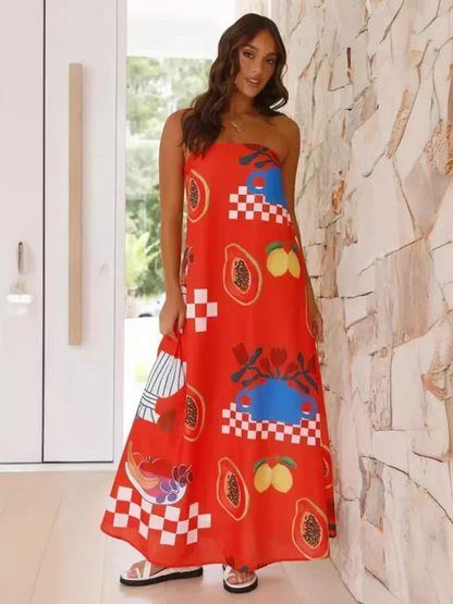 Robe longue sans bretelles, en coton léger, avec motifs estivaux colorés et volants à la taille pour un style décontracté.