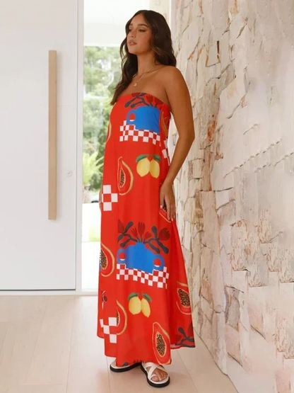 Robe longue sans bretelles en coton léger, avec motifs floraux estivaux colorés et coupe fluide pour un confort optimal.