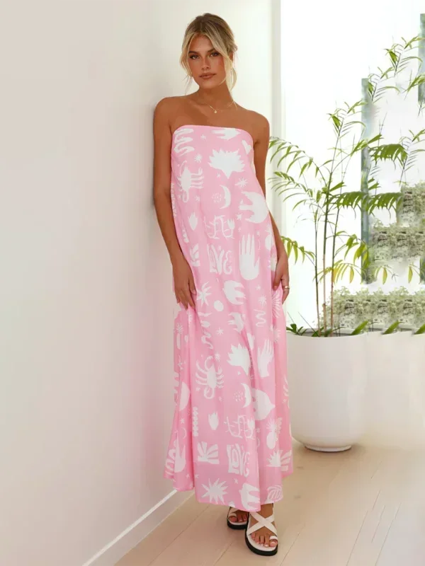 Robe longue sans bretelles en coton léger avec motifs floraux estivaux, idéale pour les chaudes journées d'été.