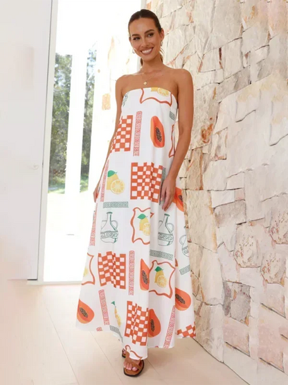 Robe longue sans bretelles en coton léger, ornée de motifs floraux estivaux parfaits pour les journées chaudes.