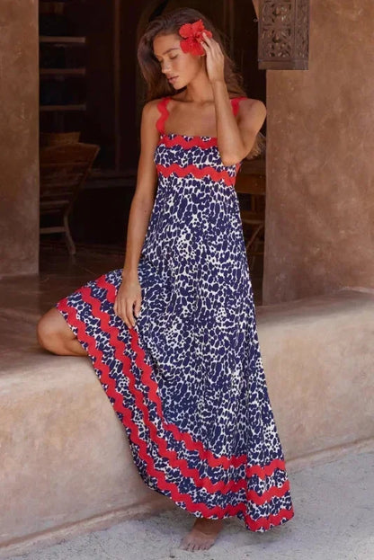 Robe longue femme sans manches en marine, avec un bord ondulé et une coupe fluide pour un look décontracté et élégant.